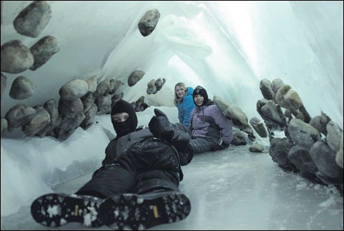 Natural caves have formed in large ice heaves at Turtle Lake near Golden Sands beach this winter. Alan Corbeil, his family and a few others summoned the courage, or stupidity, as he described it, to explore inside March 3. Corbeil adds it was a once in a lifetime experience. In the photo, from front to back are Adam Corbeil, Joelle Corbeil and Adrianna Hamm.