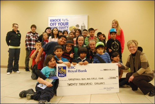 Elaine Bendel, Branch Manager and Mutual Funds Representative with the local RBC branch, took some of the children of the Battlefords Boys and Girls Club on a tour of the vault Wednesday. The RBC also used the occasion to give every child a sling bag and donate $20,000 to the club. In the last seven years, the local RBC branch has donated a total of $160,000 to the Boys and Girls Club.
