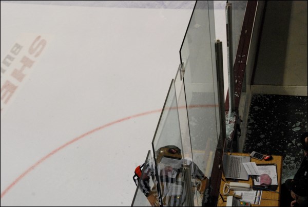 Tanner Quinn was hit by Dustin Skilliter to smash the glass on the penalty box door, resulting in a delay of around 5 to 10 minutes.