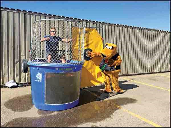 The Battlefords and District Co-op Kids Club Carnival, held Sept. 6  at the Co-op Territorial Place Mall, welcomed more than 700 Kids Club members and approximately 2,200 people attended the event. Featured activities included a dunk tank, carnival games, Beeper the Clown, music by Precision Sound, free food and drinks for all children 12 and under, bouncy houses, tractor pull, Ferris wheel, helium balloons and face painting by the Battlefords Boys and Girls Club. The dunk tan, a new venue, raised more than $1,000 for the Battlefords United Way. Cooper made an appearance as well and was given the official countdown for the dunk tank. Another popular game was a cow-milking race game.
