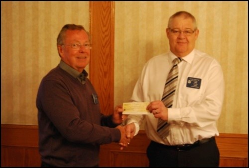 The Battlefords Rotary Club received a generous donation from Vic Pearsol&#8217;s estate Tuesday, at the Rotary Club&#8217;s annual Rotary Day lunch. Harvey Walker, left, presented Lee Ulmer of the Rotary Club of the Battlefords with the cheque. Walker, Pearsol&#8217;s friend and executor, announced the first installment of Pearsol&#8217;s donation at the lunch Tuesday, a total of $23,214.28. Though the total donations have not been announced yet, they are likely to come to around $50,000.
