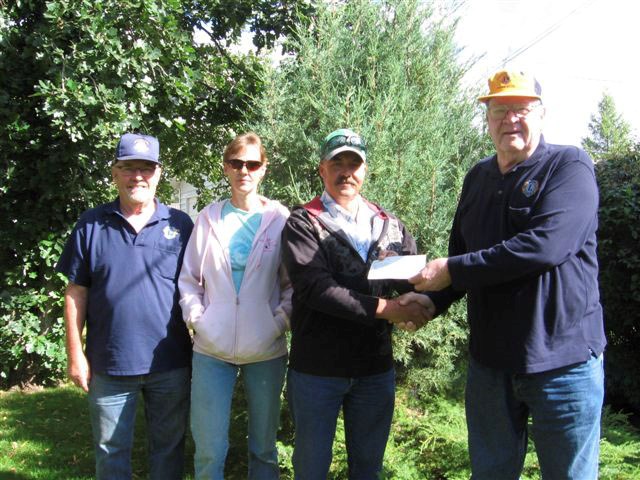 Winners of the North Battleford Lions Cash Draw were recently presented with their $5,000 prize. In the photo are Lion Gordon Mullet, Mr. and Mrs. Eric Huard and Lion Gib Volk. Second prize winners of of $500 were J. and Kody Salewski. <br>Photo submitted