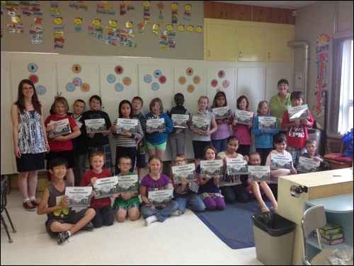 Grade 3 students from Bready School visited the City of North Battleford Historic Archives in June, where archivist Tammy Donahue Buziak talked to them about the time capsule that is being assembled to commemorate the City&#8217;s centennial. The students asked questions about what a time capsule is, where they are placed and what goes into one. Some of the students had contributed art to the student art showcase, My North Battleford. At the end of their visit the students were presented with copies of Reflections of North Battleford.