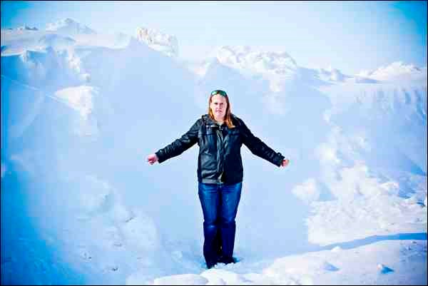 Above, Amanda Risling of Wilkie stands in front of a snow pile eight kilometers west on Highway 14 at the Scott turnoff.