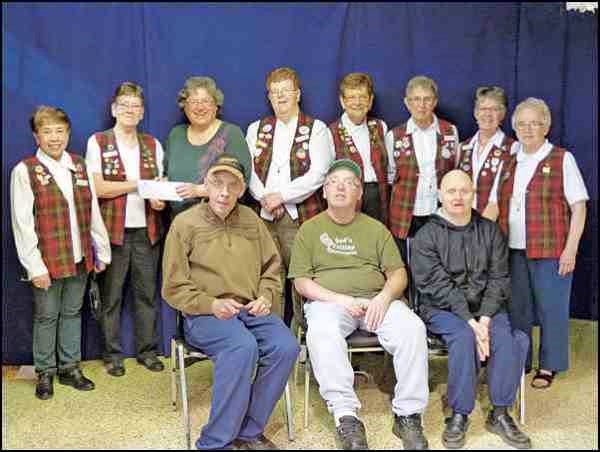 The Bonaventure Lions present Battlefords Trade and Education Centre with a $17,492.50 donation. The money was raised at their 25th annual Dinner and Art Auction March 7. The Lions choose a different charity every year to benefit from the proceeds and this year BTEC was the grateful recipient. The money will go to the New Building Fund.  In the picture are Lion Naty Keys, Lion Joyce Ruzesky, BTEC office manager Ronda Johnson, Lion June Newsham, Lion Darrallene Lapp, Lion Linda Laycock, Lion Sharon Brydges and Lion Gwen Volk and in the front row are BTEC participants Stanley Schulkowsky, Mark Reimer and Kenny Perkins.