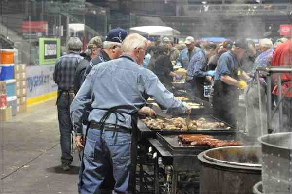 Fresh sausages were being grilled at the 69th annual Smoker hosted by the Battlefords Wildlife Federation at the North Battleford Civic Centre Saturday night. Diners lined up almost completely around boards of the ice rink to sample the wild game.