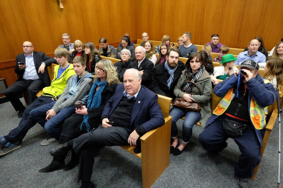 Mayor Wayne Wright is among the crowd watching the results come in at New Westminster City Hall.