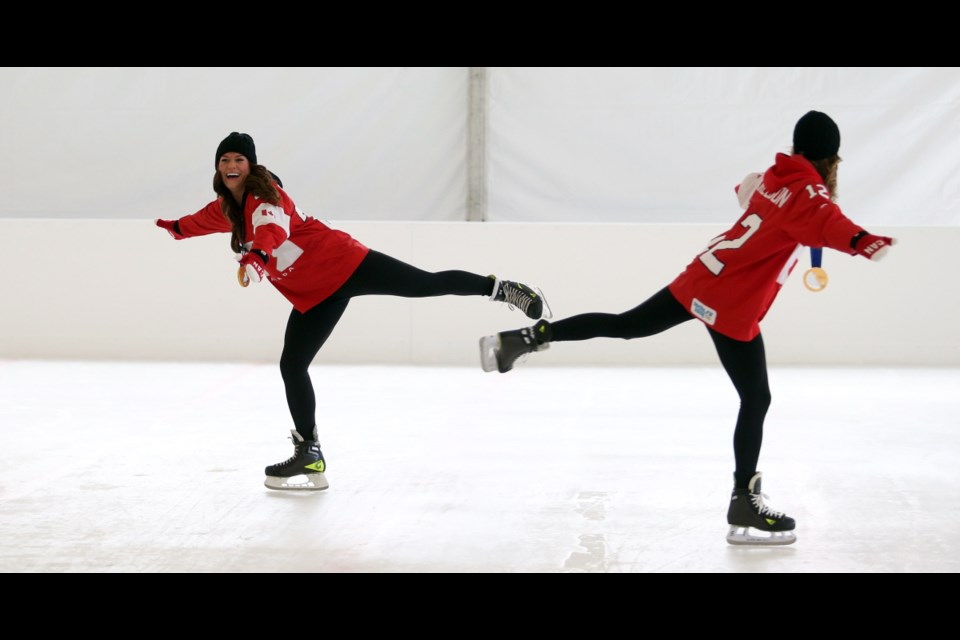 Wednesday: Olympic gold medallists Natalie Spooner and Meaghan Mikkelson check out the skating rink in front of The Fairmont Empress.