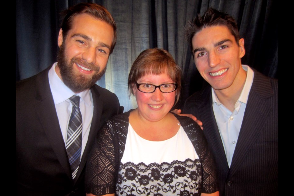 Vancouver Canucks Chris Higgins and Alex Burrows flanked Special Olympics B.C. athlete and Sports Celebrities Gala keynote Kristina Ettema at the interactive fundraiser held at the Hotel Vancouver.