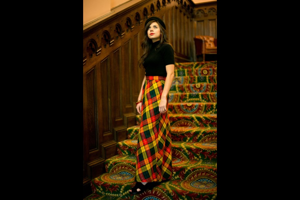 Model Alessandra Casanova wears a vintage plaid high-waisted maxi skirt and cashmere blend black turtleneck and accesories from Maven's Vintage Apparel (532 Herald Street).