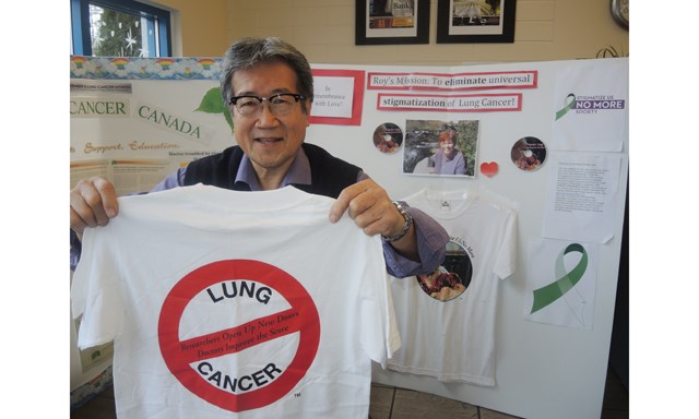 Former school principal Roy Sakata displays a t-shirt promoting his campaign to de-stigmatize lung cancer.