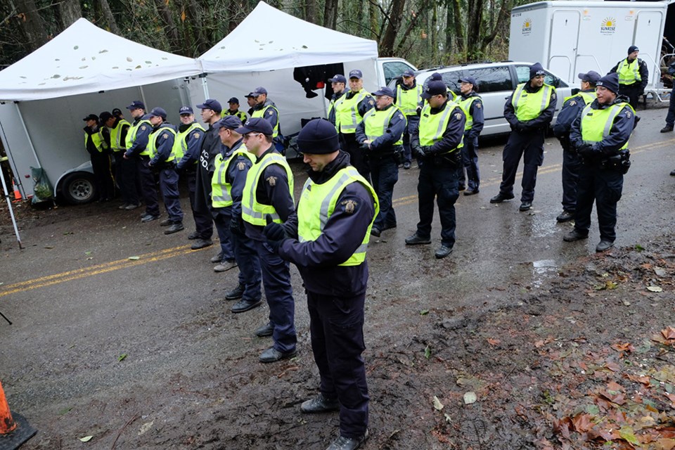The policing bill for Burnaby Mountain will be expensive, and Burnaby Mayor Derek Corrigan is hoping Kinder Morgan will help pay.