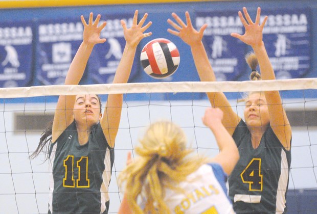 Argyle's Sarah Haysom (left) and Kendra Finch throw up a big double block in a match against Handsworth earlier this season. Haysom and Finch were both named tournament first team all-stars as the Pipers claimed gold at the provincial AAAA championships Saturday in Cranbrook.