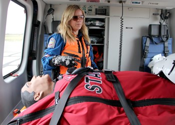 Stars is taking their new helicopter around the province to help familiarize local emergency services with the new machine. Pictured above, Tara Oliver demonstrates some of the features inside the aircraft.