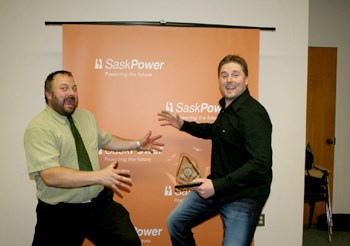 Among the recipients of awards at the 2012 Yorkton Chamber of Commerce event held last Wednesday in the city was Justin Yawney, owner of Yorkton Plumbing & Heating. Yawney took home the Young Entrepreneur award, presented to a young entrepreneur (age 35 or under), who has established or expanded a business. The young entrepreneur will have achieved success in the start-up or operation of a new or existing business and will have long term goals and the strategies to achieve the goals. Yawney started Yorkton Plumbing & Heating in 2007 and in the past four years has grown the company from a staff of one to twenty-five, expanding his fleet of one vehicle to fifteen. Originally from Yorkton, Yawney moved to Alberta but found that coming home was the best move he could make. His roots, family, and friends are in the Yorkton community and gave him support and encouragement to expand his business. Not only does Yorkton Plumbing & Heating provide service to the residential community, but it has expanded in the commercial and industrial field, which he says has proved to be very rewarding. Yawney is pictured above (right) hamming it up with his award with Jonas Haywood, Area Manager, TD Canada Trust, award sponsor.