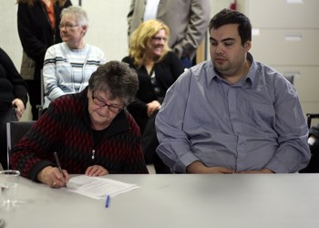 jimmy&#8217;s law, a proposed piece of legislation designed to help protect people who work in retail businesses late at night, has relaunched a petition to show support. The push for the legislation began last year, after Jimmy Wiebe was killed in a robbery while working the overnight shift at a local gas station. Pictured above, Annie Wiebe, Jimmy Wiebe&#8217;s mother, (l) signs the petition as Aaron Nagy, who started the movement, looks on.