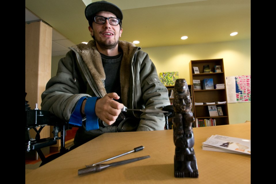 Robin Unger displayed his pyrophyllite totem carving at the Victoria Disability Resource Centre's art show to celebrate the United Nations' International Day of Persons with Disabilities on Wednesday, Dec. 3, 2014.