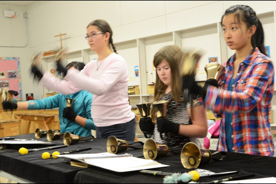 Members of the Burnaby school district's Sound Wave handbell choir rehearse at Inman Elementary.