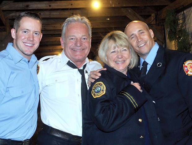 Marieanne Hansen with Hall of Flame Calendar Firefighters Sean Middleton, Pete Popovich and Andy Sojka