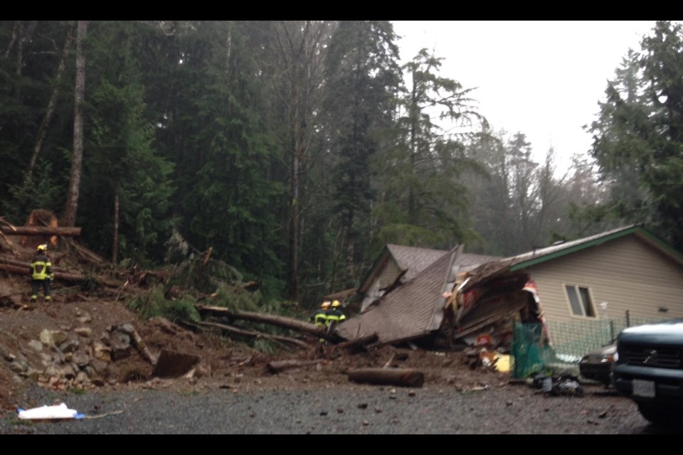 A landslide likely caused by heavy rain destroyed a house at Little Qualicum River Estates on Wednesday, Dec. 10, 2014.