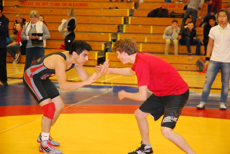Elphi wrestler Xavier Benoit-Benjamin, right, takes on a competitor from Carson Graham at the Dec. 4 Rudolph Rumble in Gibsons. See more photos and video in our photos and video section.