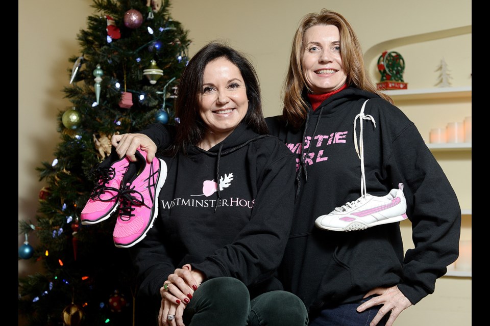 Susan Hogarth, left, and Sarah Franklen of Westminster House, held a Make Your Shoes Count holiday challenge in 2014. It was one of the local organizations featured in last year's Guide to Giving.