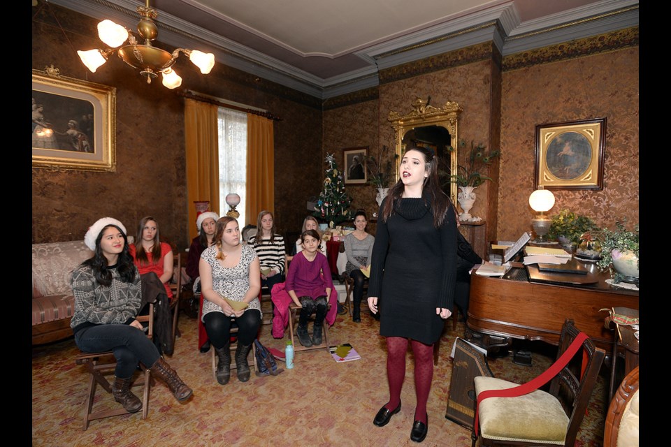 Lou Weninger and students recently performed at the traditional Victorian Christmas at Irving House.