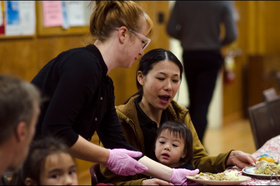 Burnaby NOW reporter Jennifer Moreau volunteers at the annual Christmas dinner, organized by the Burnaby Rotary Club.