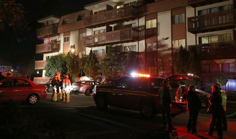 Firefighters on the scene of an apartment fire off Esquimalt Road on Dec. 22, 2014.