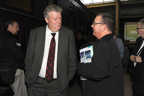 Deputy Premier and Minister of Natural Gas Development Rich Coleman, left, chats with an event attendee, Everett McLaren of Canada Culvert, at the government's Science World LNG seminars in Squamish Dec. 17.