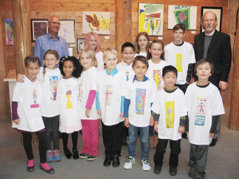 The 20 youthful winners of the Sechelt banner design project are seen here at the Arts Centre with sponsor Neil Clayton and Sechelt Mayor Bruce Milne (back row left and right) who congratulated each child and awarded them their own T-shirts.