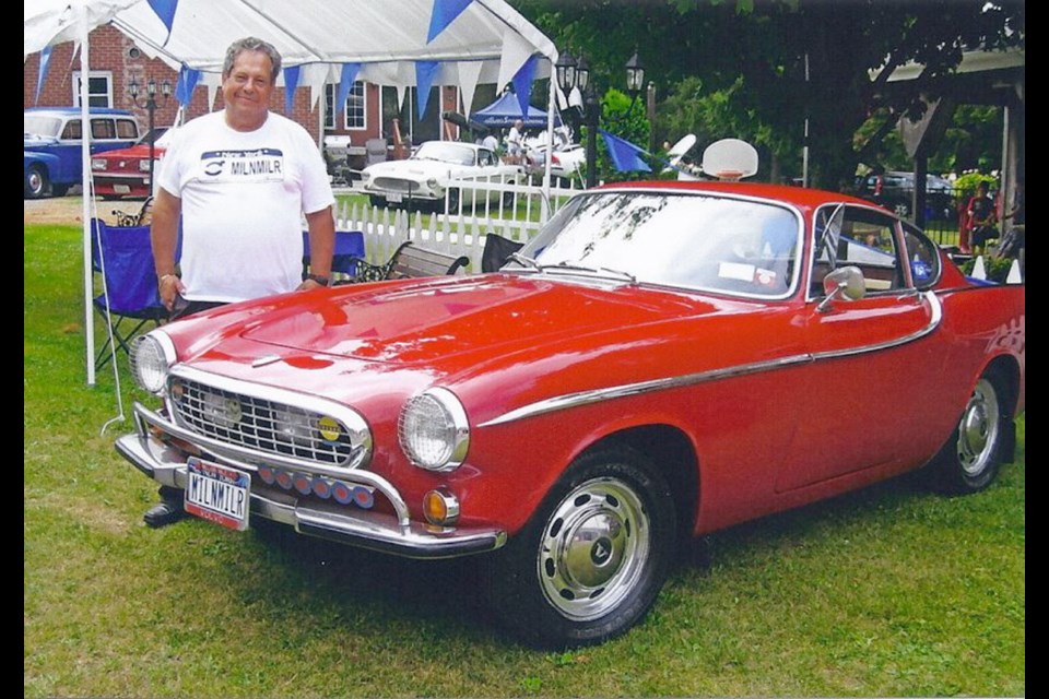 Irv Gordon, of Long Island, New York, with the Volvo 1800 coupe he bought for $4,150 in June 1966.