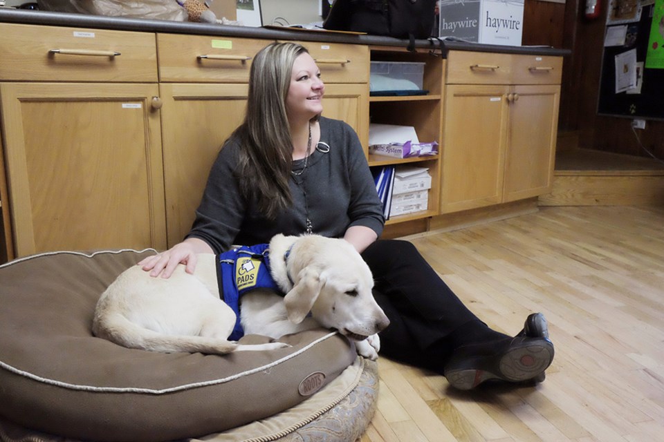 Kim Gramlich and her sidekick Caber. Gramlich is the coordinator for the Delta Police victims services program, and she takes Caber with her to help crime victims deal with trauma.