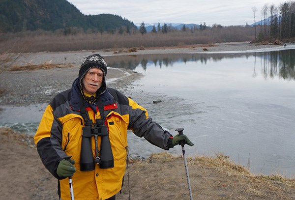 Eagle enthusiast Bruce Matthews stands beside one of the many trees cut next to the CN Railway bridge on the south side of the Mamquam River dike. Matthews said the trees were prime eagle-roosting trees and he is unhappy the District of Squamish cut them down..