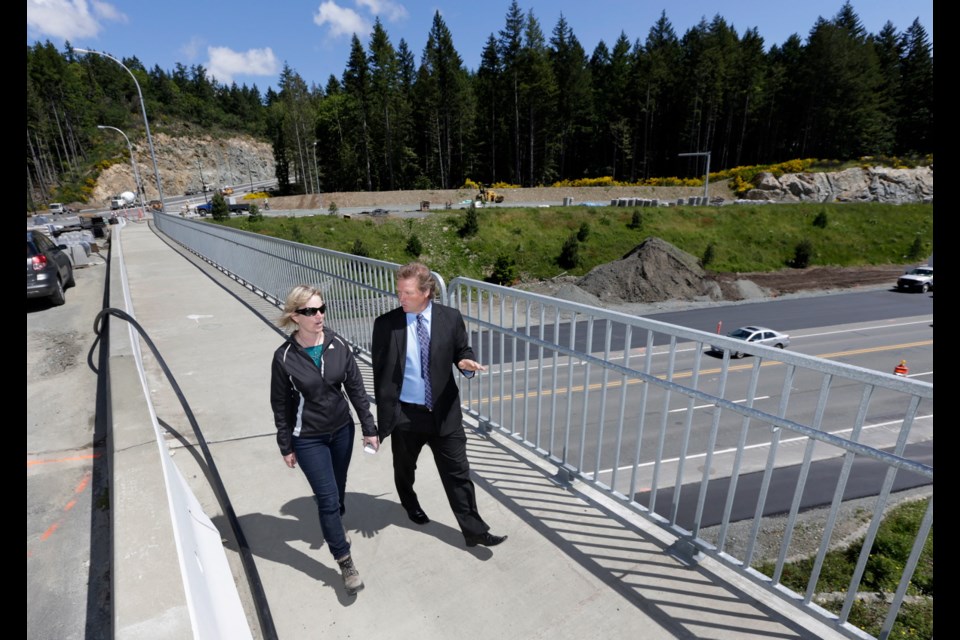 Langford Mayor Stew Young and the municipality's director of engineering, Michelle Mahovlich, cross the Leigh Road Interchange.