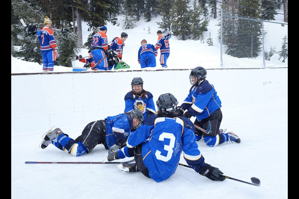 Vancouver-based Hatchicks player Tanya Durman warms up with her teammates before a game against the South Okanagan Ice Dragons during this past weekend’s Apex Shootout hockey tournament. The Hatchicks lost 6-2 to the Ice Dragons which went on to win the women’s championship. Photograph by: Rebecca Blissett