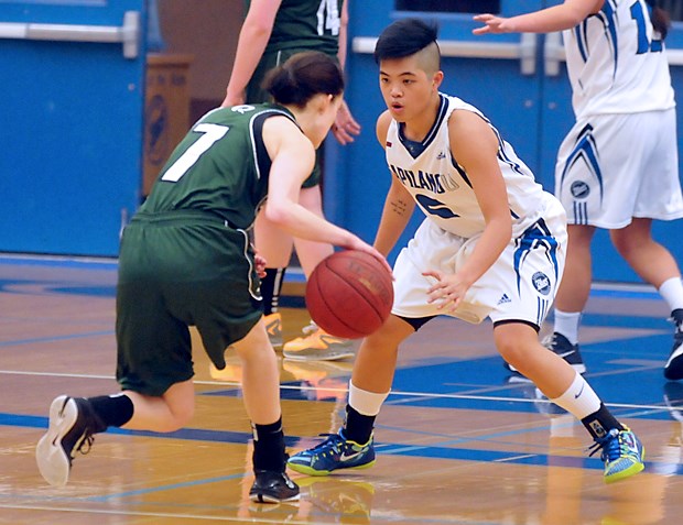 Capilano's Ashley De La Cruz Yip defends Quest's Andrea Eidsvik during a PacWest league game Friday at the Capilano Sportsplex. Quest won the game 69-56 to remain undefeated in league play and drop the Blues to 4-4.