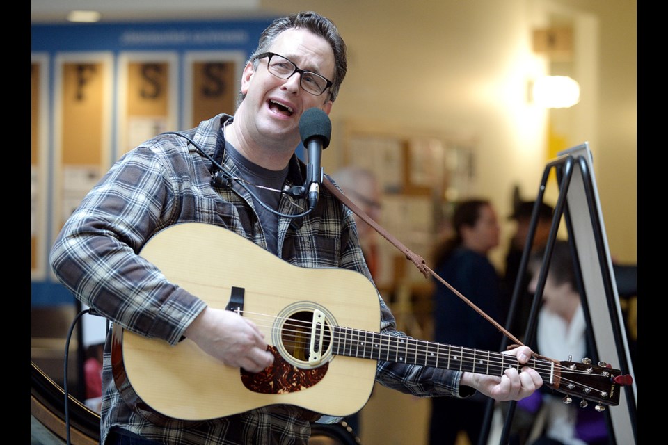 Jeff Neufeld performs during the Royal City Farmers Market's winter market, Saturday (Jan. 17) at River Market.