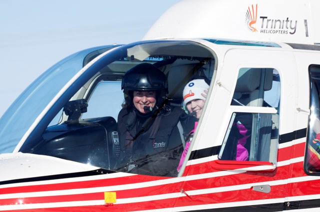 Kirsten Brazier, in one of her many piloting roles, in charge of a helicopter at one of the Sky's No Limits — Girls Fly Too! events, designed to entice more young girls and women to consider a career in aviation and aerospace