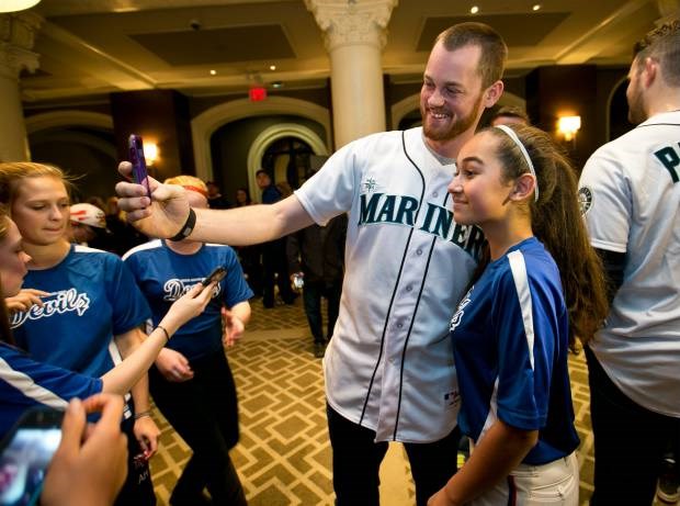 Seattle Mariners pitcher Charlie Furbush takes a selfie with Kamryn Manak, 13, at the Fairmont Empress hotel.