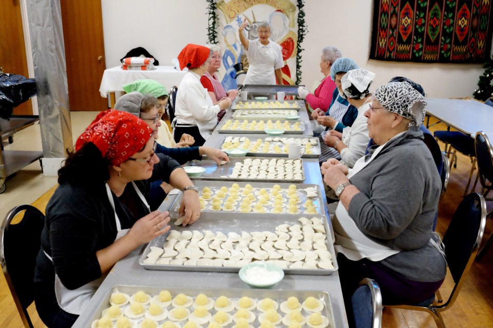 The crew at Holy Eucharist Church preps perogies for Friday's sale and dinner.