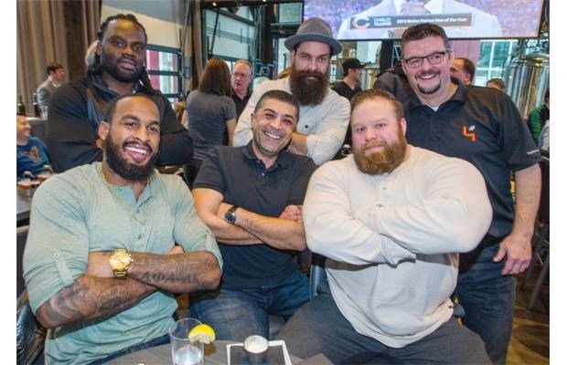 Some of B.C.’s toughtest dudes, including BC Lions’ Solomon Elimimian, back left, and Chris Davies, front right, holder of B.C.’s Strongest Man title.