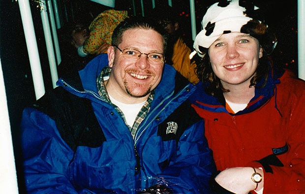 Karin Retallick and Rob "This is a picture of my husband Rod and I on the evening we got engaged. It was December 23, 2000, and we were waiting to ride the train at Stanley Park. This photo was snapped by some very kind strangers sitting near us. By the end of the ride, they were as excited as we were! Rod completely surprised me with a ring as we rode through the Christmas displays. I said yes, and we've been married since July 2001."