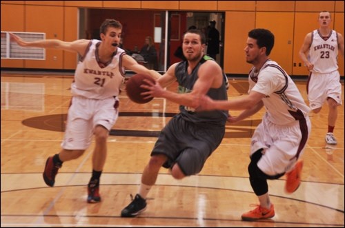 Quest's Theo VandenEkart drives to the hoop against Kwantlen on Saturday (Feb. 7).