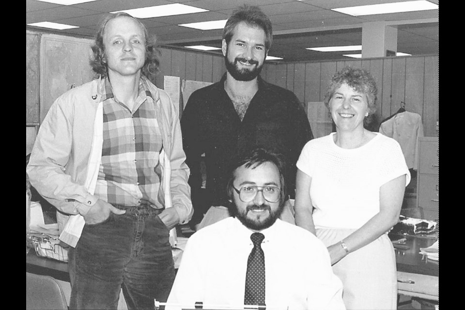 The Alberni Valley Times newsroom in the early 1980s with (back, left to right) sports editor Carl Vesterback, reporters Gavin Wilson and Jan Peterson, and editor Rob Diotte (in front).