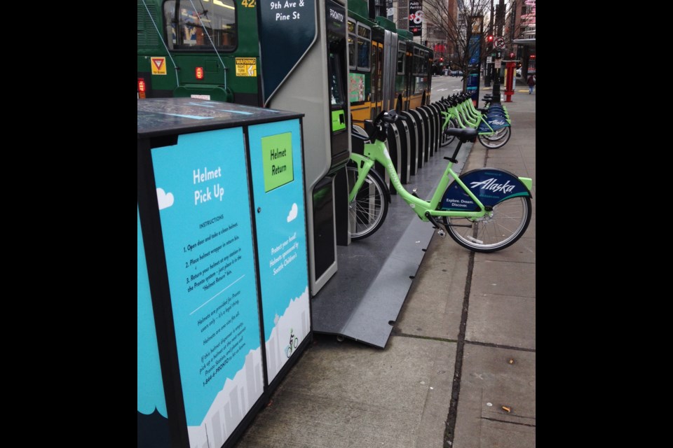 Seattle has a helmet law and Motivate set up bins at stations, where bike share users can pick up and drop off helmets. They are cleaned, inspected and recycled. Photo Michael Kissinger
