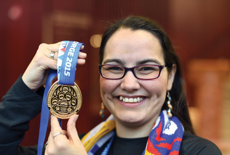 Jennifer Pighin with the medal she designed for the 2015 Canada Winter Games.