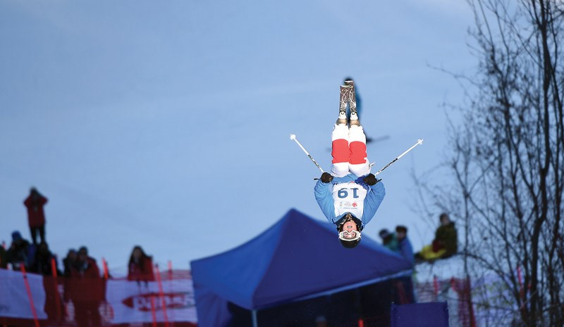 Laurianne Desmarais-Gilbert from Team Quebec goes off the second jump on the mogul course at Tabor Mountain Tuesday during the Canada Winter Games.