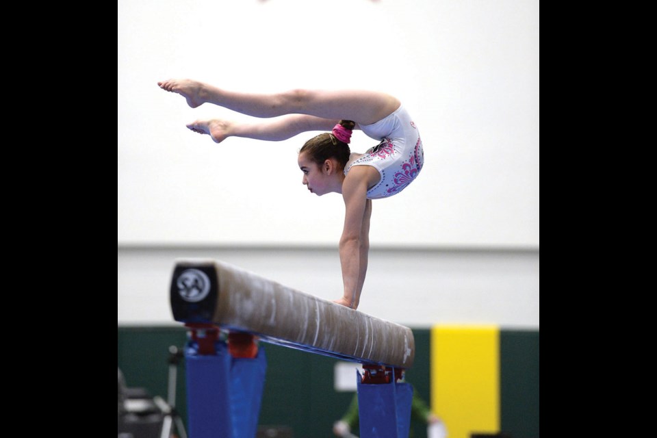 Ilka Juk, 11, from Team BC on the balance beam Thursday at the Northern Sport Centre during the Canada Winter Games.