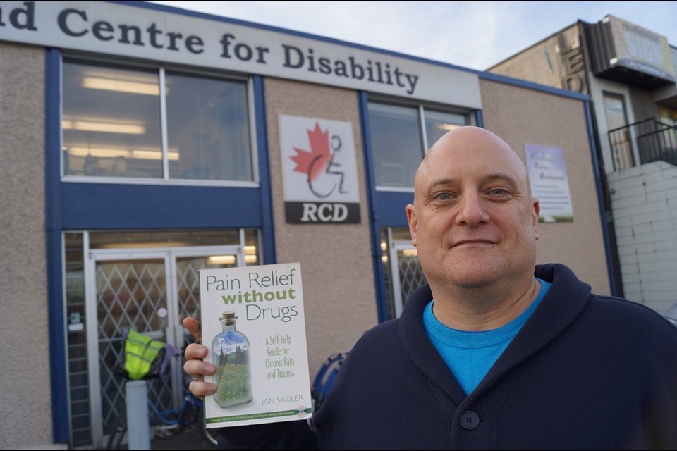 Dave Thomson, education coordinator with Richmond Centre for Disability, has tried all manner of therapies to help him cope with the pain caused by fibromyalgia disorder. Photo by Graeme Wood/Richmond News.
